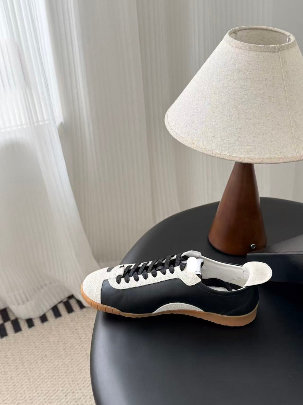 TRAINERS IN BLACK AND WHITE CALFSKIN AND EMBOSSED SUEDE