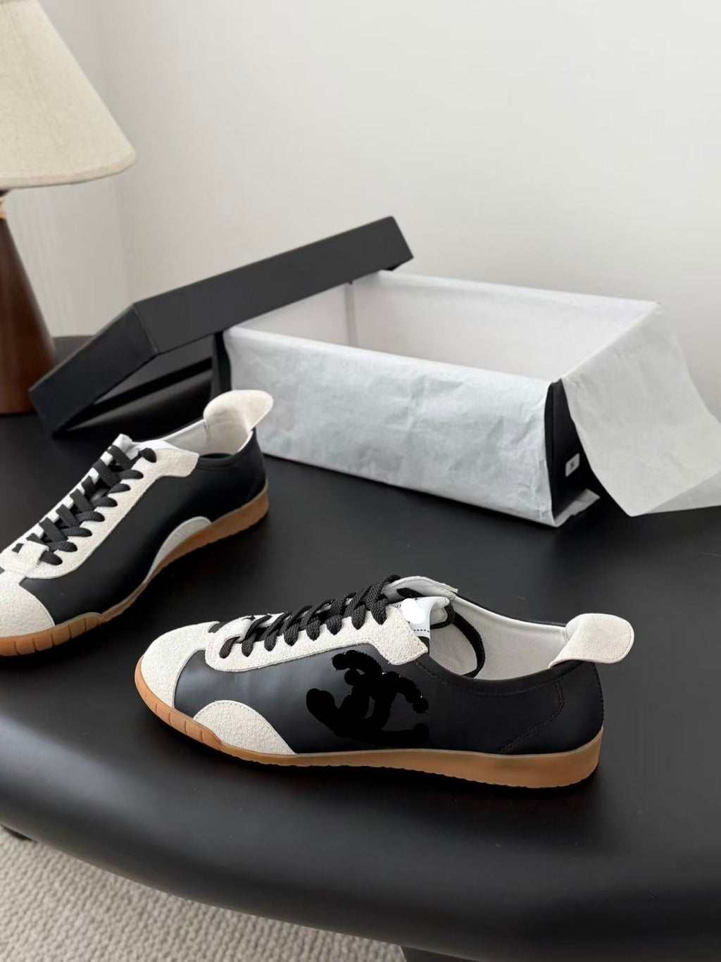 TRAINERS IN BLACK AND WHITE CALFSKIN AND EMBOSSED SUEDE